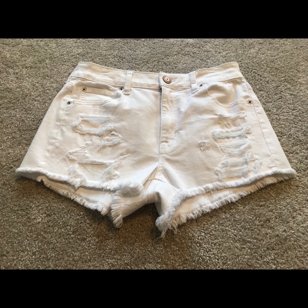 white ripped shorts